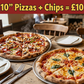 Two pizzas on a table with a bowl of fries and cutlery, in a restaurant setting.